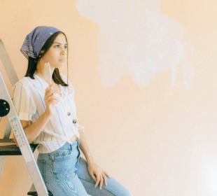 Woman Painting a Wall