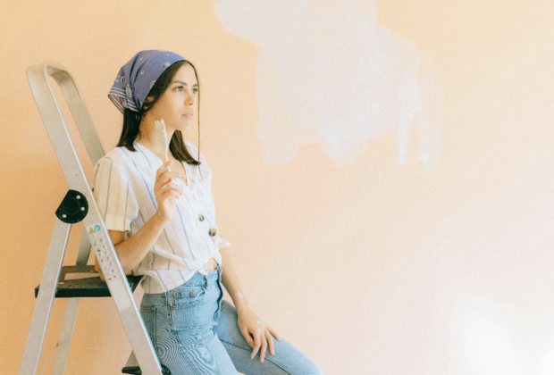 Woman Painting a Wall